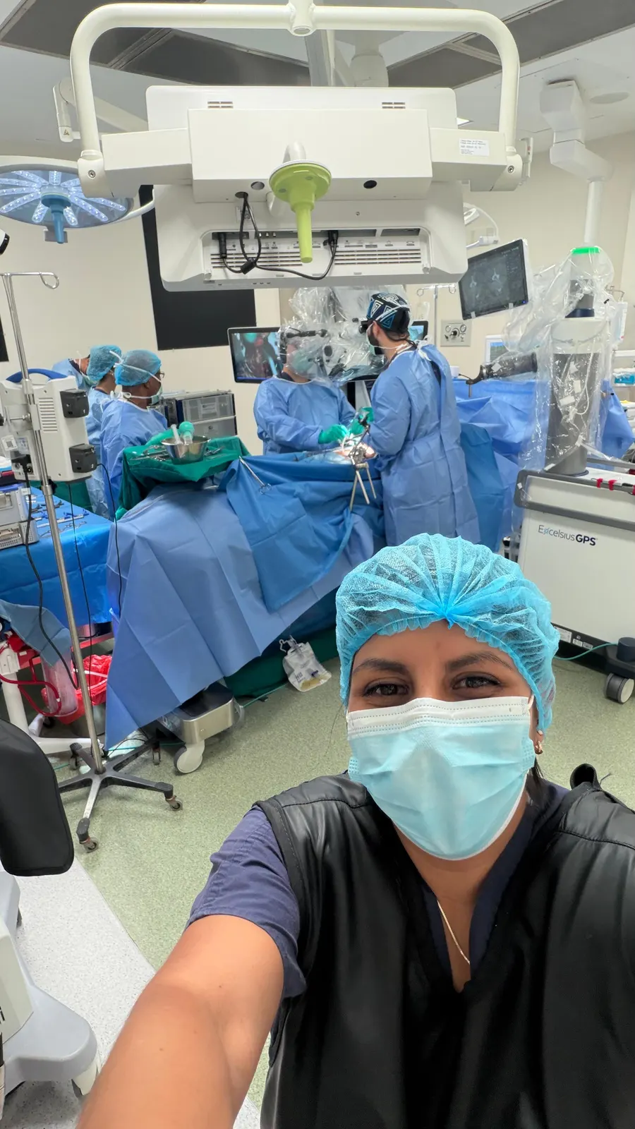 Our photographer inside an operating theatre while the surgical team works with a robotic navigation system